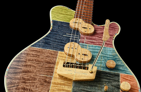 Jersey Girl Homemade Guitars - Tapa Festeeva with multicolored wood finish and unique design.