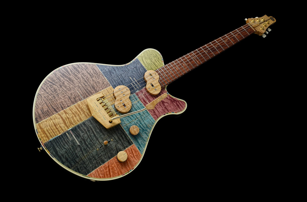 Jersey Girl Homemade Guitars - Tapa Festeeva, a handcrafted guitar with a colorful wooden design, made in Japan.