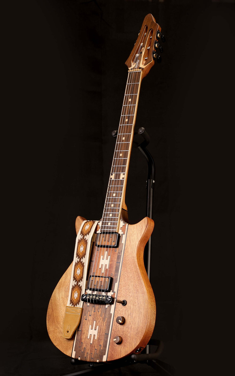 Myōōz guitar Legacy Model One with unique wooden design and intricate detailing, showcasing its craftsmanship.