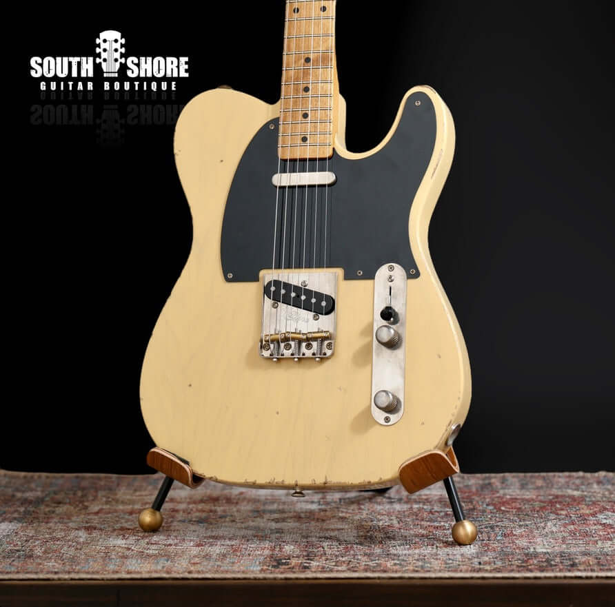 K-Line Truxton - Butterscotch Blonde. NEW, (Authorized Dealer) displayed on a guitar stand.