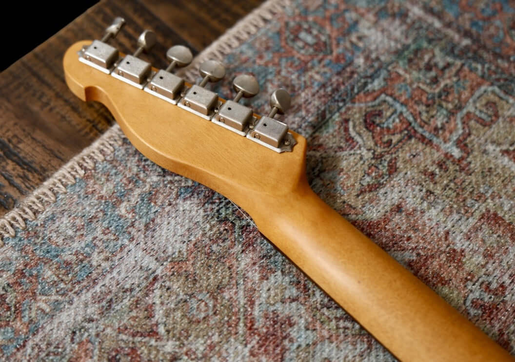 K-Line Truxton - Olympic White, NEW (Authorized Dealer) guitar headstock on patterned rug.