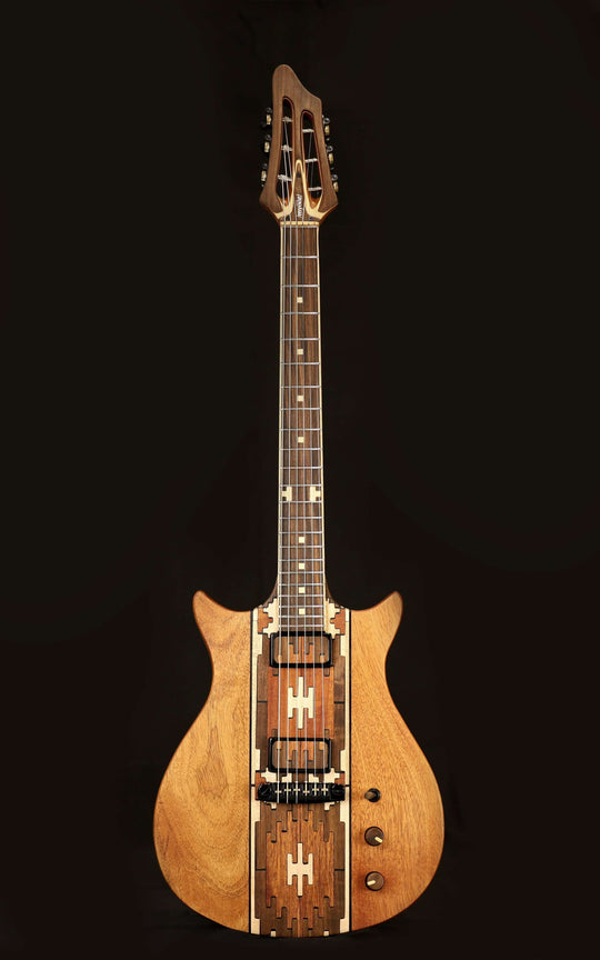 Myōōz guitar Legacy Model One, featuring a unique wooden design with intricate inlays and controls.