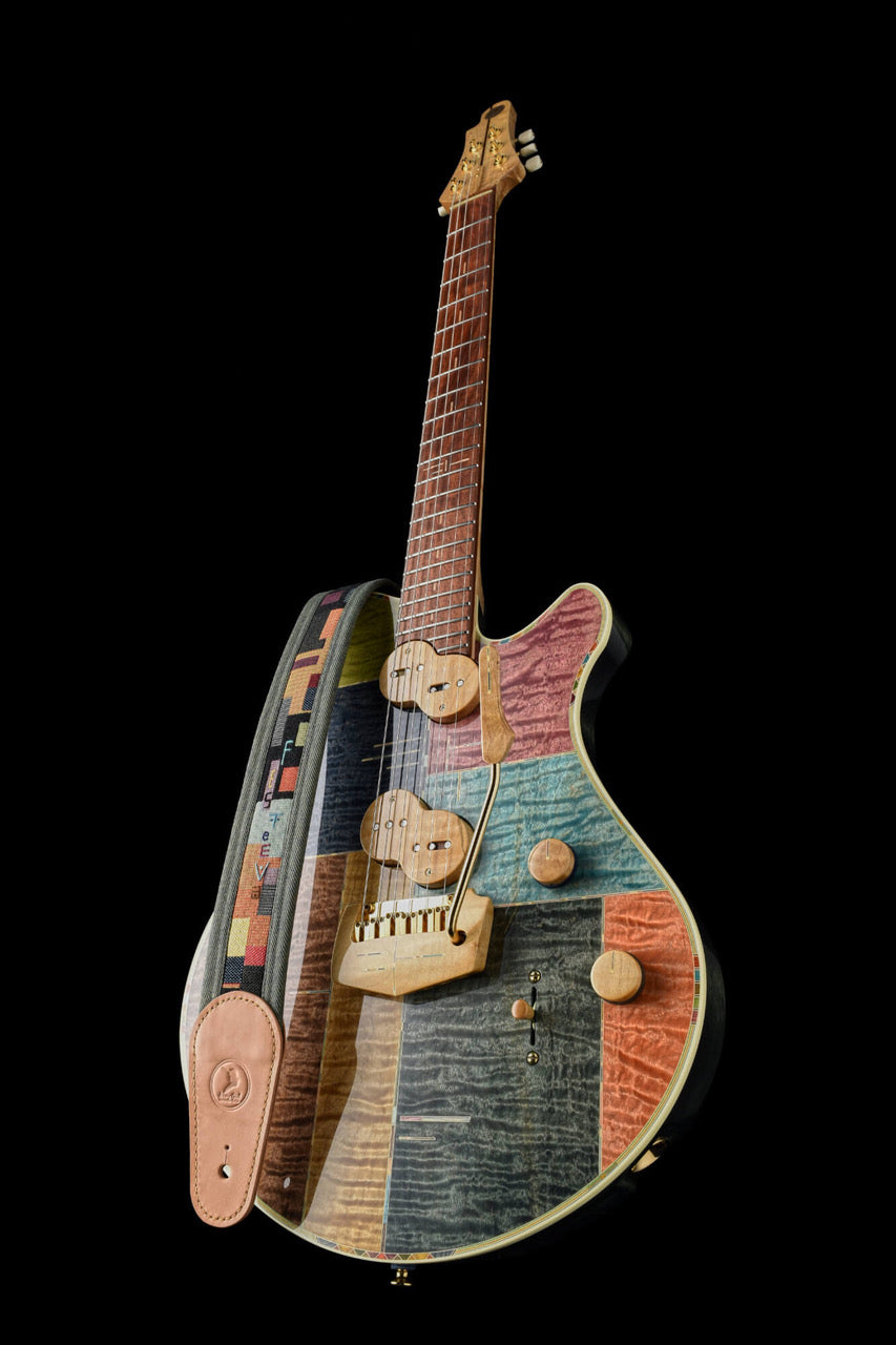 Jersey Girl Homemade Guitars - Tapa Festeeva, handcrafted guitar with colorful inlays and unique design.