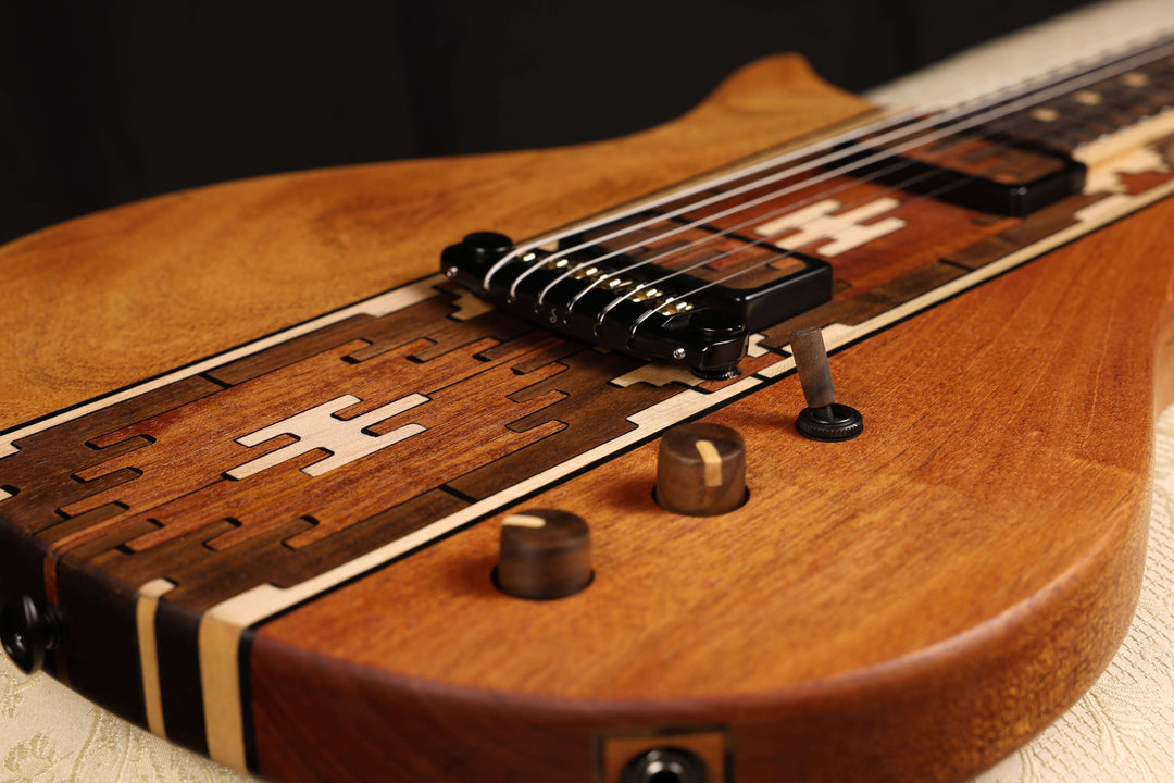 Myōōz guitar Legacy Model One close-up showing unique wood design and craftsmanship.