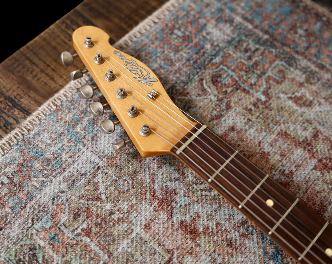 K-Line Truxton - Olympic White, NEW (Authorized Dealer) guitar headstock on a textured rug.