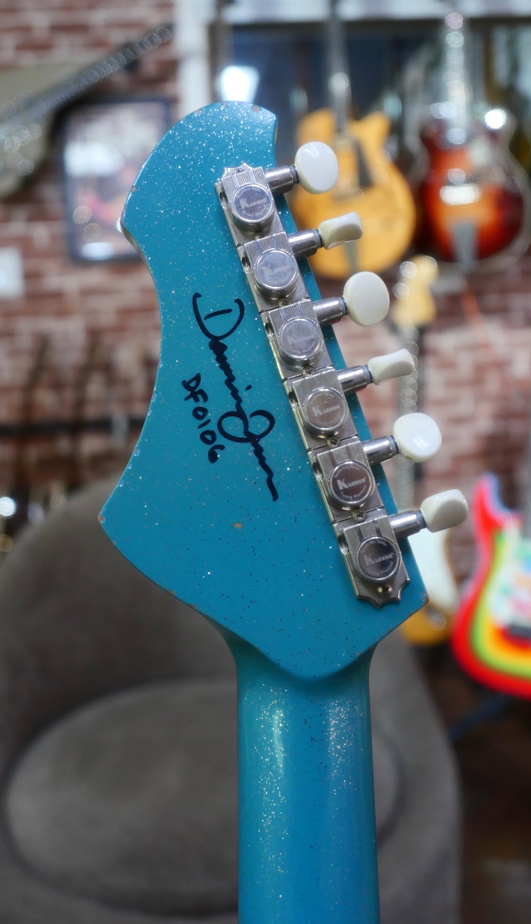 Novo Serus T Taos Turquoise guitar headstock designed by Dennis Fano, model SN# DF0106.