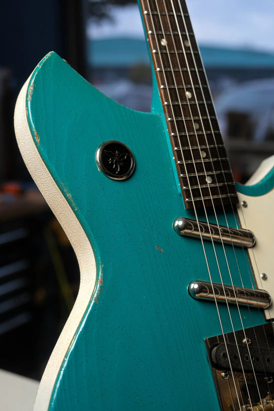 Novo Serus T Taos Turquoise guitar showcasing its unique craftsmanship and vintage-inspired design.