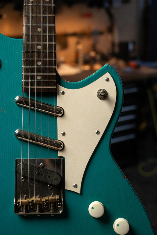 Close-up of the Novo Serus T Taos Turquoise guitar, showcasing its unique body shape and intricate details.