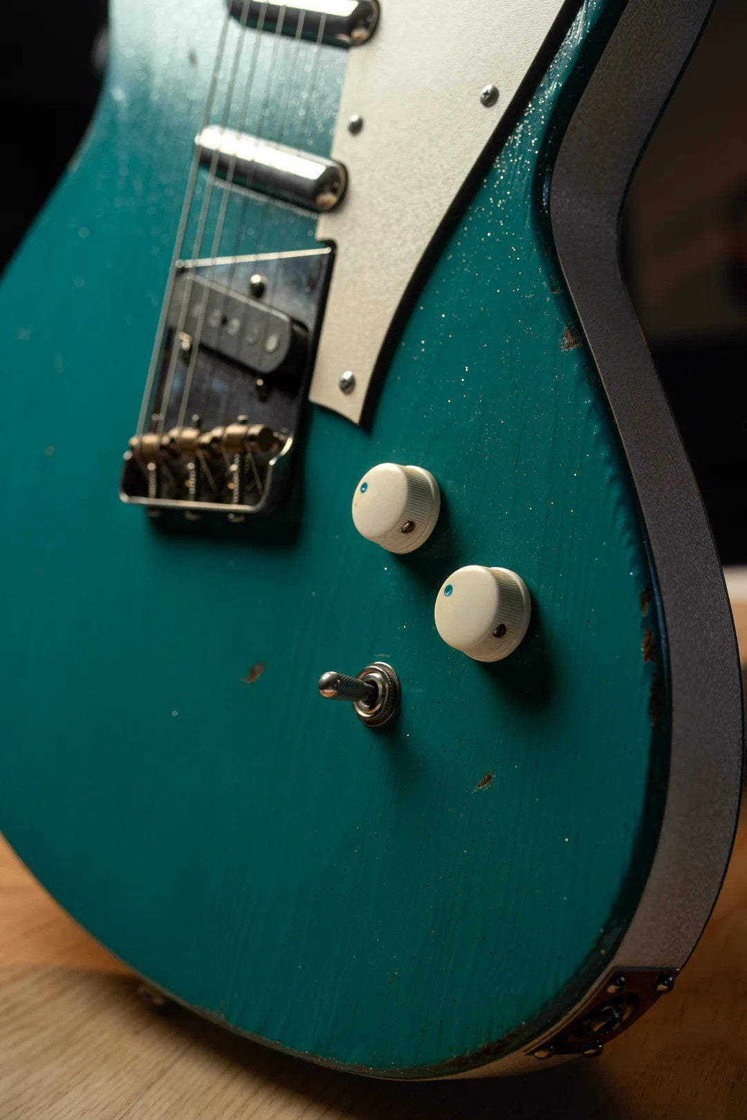 Close-up of the Novo Serus T Taos Turquoise guitar showcasing its striking finish and unique controls.